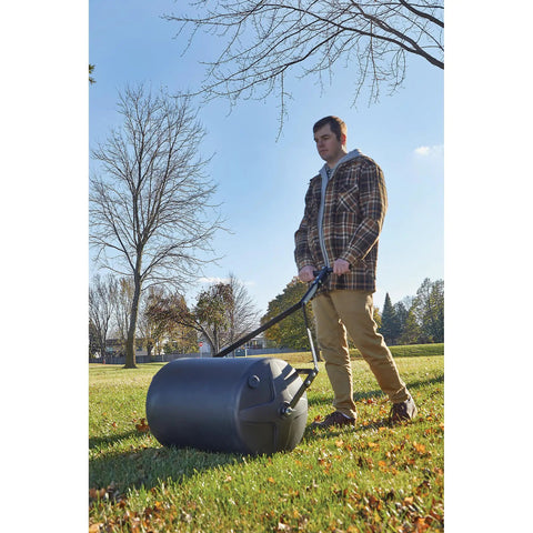 Man using Lawn Roller 18 Inch Diameter 24 Inch Wide Poly Drum Holds Up To 270 Lbs And 31.1 Inch Working Width For Versatile Push