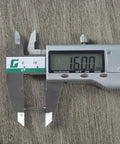 Stainless steel keyboard switch spring measured at 16.00 mm with digital caliper