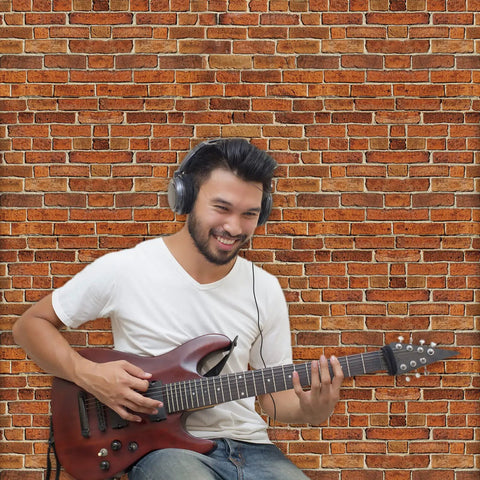 Man playing guitar in front of Brick Wallpaper Peel And Stick Set 4.5x9 Feet Removable Tablecloth Backdrop Self Adhesive