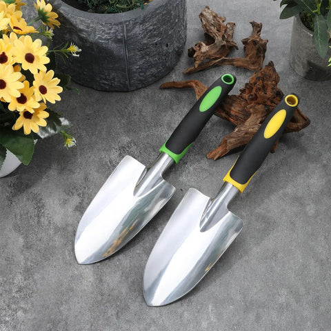 Two hand shovels from the 10 Piece Go To Garden Trowel Set With Heavy Duty Hand Shovels Soft TPR Handles on concrete surface.