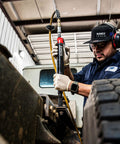 Mechanic uses Beast Heavy Duty Air Needle Scaler for tough surface prep on metal, showcasing use in industrial maintenance.