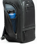 Black 30L Camera Backpack For Photography And Video Gear With Full Front Panel Access featuring a water bottle in the side pocket.
