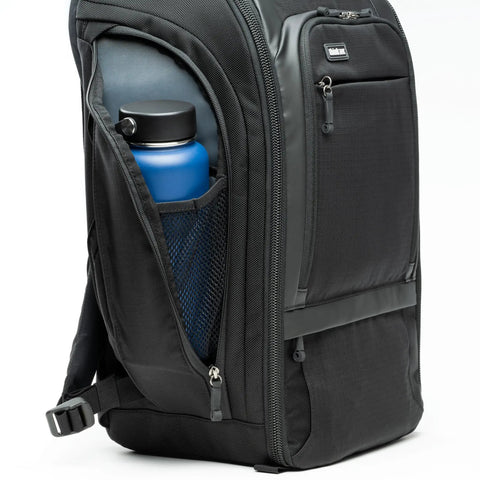 Black 30L Camera Backpack For Photography And Video Gear With Full Front Panel Access featuring a water bottle in the side pocket.