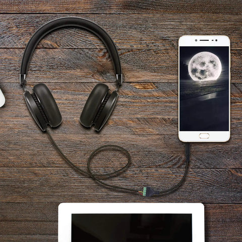 3.5Mm Audio Terminal Block 1/8 Inch TRRS Screw Connector in use with headphones and smartphone on wooden surface.