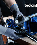 Person using All In One Ratcheting Pipe Threader Kit With 6 NPT Dies 1/4 Inch To 1-1/4 Inch on a pipe in a workshop setting.