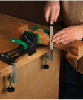 Rock Solid 6 Inch Quick Action Bench Vise With 300 Pound Clamping Power holding wooden block while sanding on workbench.