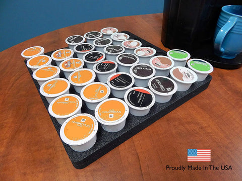 Ultra Slim Keurig K Cup Pod Organizer Tray For Kitchen And Office No Mess Waterproof And Washable Drawer Insert That Holds 36 Pods 12.5 By 12.5 Inches Made In USA displayed on table with coffee pods