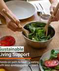 Person preparing a fresh salad with wooden utensils, displaying a healthy eating approach focused on sustainability.