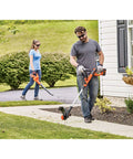 Man using 40V Max Cordless Sweeper And String Trimmer All In One With Battery And Charger Included No Wires No Fuss Convenience Auto Feed Spool Power Drive High Torque For Fast Clean Cuts Low Noise Run Up To 130 MPH Debris Clearing on sidewalk