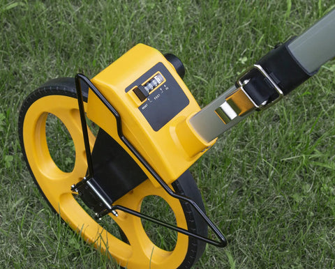 Rugged Pro 12 Inch Diameter Measuring Wheel Measures Up To 10,000 Yards With Brake And Reset Trigger showing dial and grip.