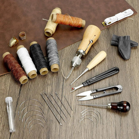 All-In-One Leather Sewing Kit With Waxed Thread, 40-Piece Awl Set, Extra Awls, 24 Leather Needles, Seam Ripper on wood surface.