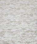Close-up view of Top Shelf Vinyl Textured Wallpaper In Crisp Off White Cream Accented With Shimmery Gold Mica Chips.