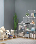 White Premium Wire Cube Storage Organizer For Home And Garage Four Cube Shelving Unit holding books, toys, with a stuffed bear.