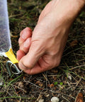 Hand securing a Rectangular Mosquito Net For Camping And Outdoors Lightweight Mesh Canopy Keeps Bugs Out Mosquitoes And Flies with hook