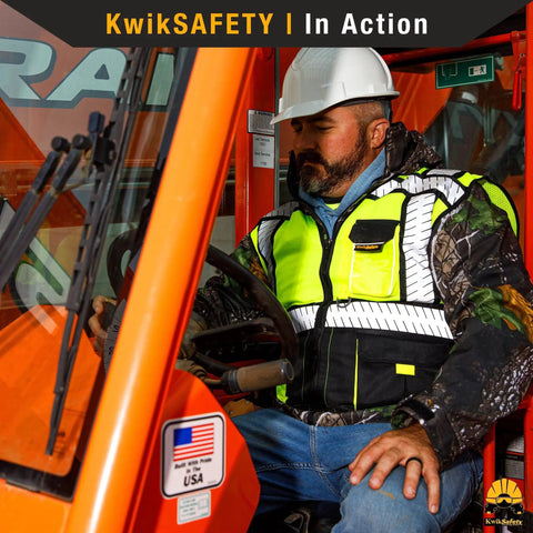 Worker wearing Hi Viz Safety Vest Class 2 ANSI OSHA Reflective Mesh With Multi Pocket Design Heavy Duty For Construction Surveyors.