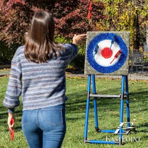 Person playing with Eight Foam And Plastic Axes Axe Throwing Game Set With Heavy Duty Steel Frame Over Five Feet Tall Folds Flat