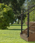 Slick Steel Cable Railing System For Stair Handrails With No Sweat Diy Complete Kit And Full Hardware Pack Pre Drilled Base Mount For Clean Modern Deck Upgrades 16 Foot Span 42 Inch Height White Finish installed on wooden stairs in a green yard.