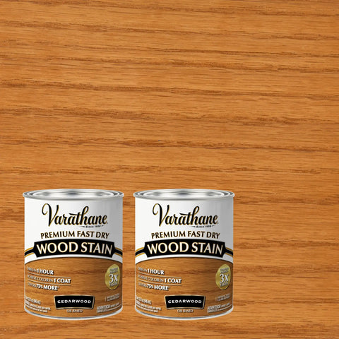 Fast Track Cedarwood Wood Stain For Home Updates One Pass Slick Protection Quick Cure two cans of cedarwood stain on wood background.