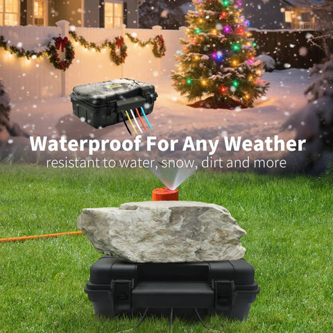 Heavy Duty Outdoor Electrical Box With Tough As Nails IP54 Rain Cover on a grassy area with a rock and holiday lights.