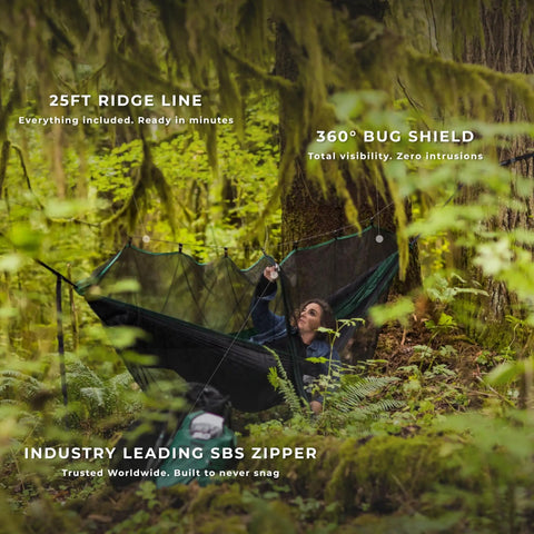 Person relaxing in All In One Camping Hammock Kit With Bug Net And Rain Fly For Easy Setup Pro Grade Ripstop Nylon in forest