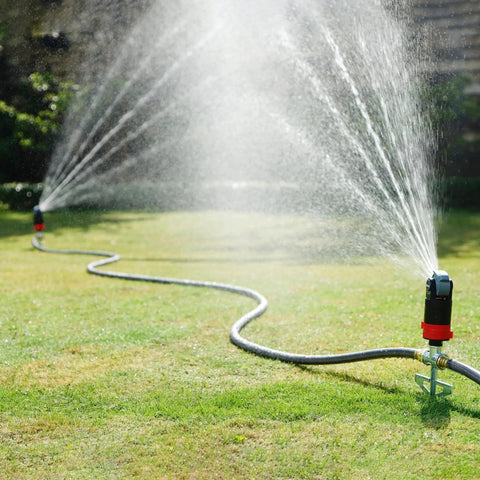 Heavy Duty Garden Watering Sprinkler System with Five Pattern Nozzle Metal Step Spike Gear Drive in action on lawn