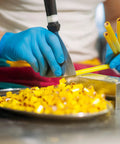 Heavy Duty Textured Nitrile Disposable Gloves Blue Medium 3.5 Mil Rugged Grip Workhorse Exam Gloves used in food prep.