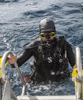 Diver wearing scuba gear climbing boat ladder, showing Bi-Focus Optical Lens For Zoom Scuba Mask Right Side 3.0 Diopter in action.