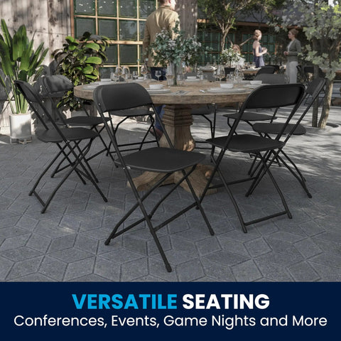 Hercules Set Of 10 Indoor Outdoor Heavy Duty Plastic Folding Chairs around a table at an outdoor event, black