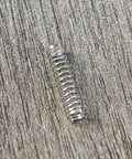Stainless steel Cherry MX keyboard switch spring, close-up view