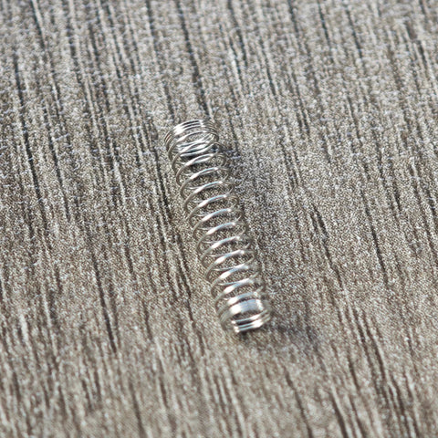 Stainless steel Cherry MX keyboard switch spring, close-up view