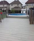 Hardcore Textured Deck Coating White 5 Gallon Waterproof Non Skid Sealant UV Resistant Hybrid Urethane Acrylic Paint applied on patio.