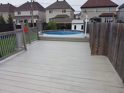 Hardcore Textured Deck Coating White 5 Gallon Waterproof Non Skid Sealant UV Resistant Hybrid Urethane Acrylic Paint applied on patio.