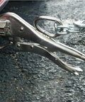 Heavy Duty Locking Pliers For Sheet Metal And Welding Duckbill Style with Large Pull Tabs in use, metal surface