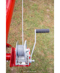 Heavy Duty Brake Winch 1200 Lb Capacity, Rust-Resistant TUFFPLATE Zinc Finish, featuring 7 In ergonomic handle, outdoor view