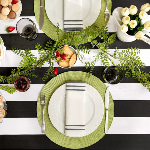 Cabana Stripe Outdoor Zippered Tabletop Cover 60 by 84 Inches Stain Resistant and Waterproof Machine Washable Easy Care for Patio Tables That Seat 6 to 8 Black with decorative table setting.