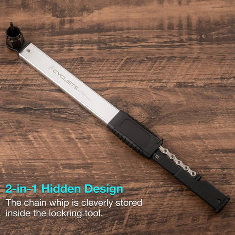 Two In One Chain Whip And Lockring Tool For Cassettes on wooden surface, showcasing compact design with chain whip inside handle.