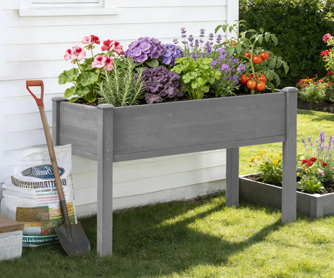 Waist-Height Raised Garden Bed With Legs, 48 By 24 By 30 Inch Solid Wood Planter Box Stand With Liner For Outdoor Patio, filled with plants.