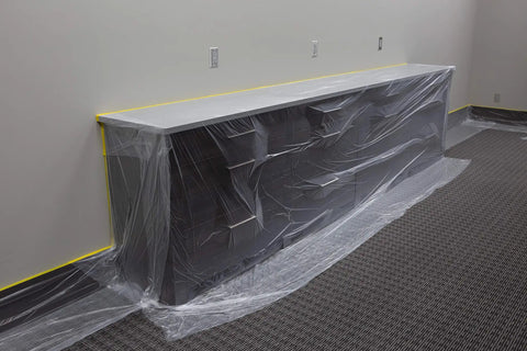 Pre Taped Masking Film With Three Quarters Inch Tape 9 Feet By 65 Feet Twelve Pack Pro Grade Lightweight High Density Protective Film in use
