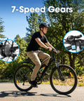Rider on All Terrain Electric Mountain Bike With 1000W Peak Power, 7 Speed Shifting, showing 26 Inch Wheels and gear details.