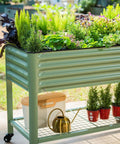 Raised Garden Bed V Series 2 Ft By 4 Ft With Legs And Storage Rack For Patio Porch, filled with plants, olive green color