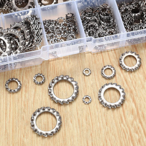 Top-down view of stainless steel external-tooth star lock washers in assorted sizes beside a clear plastic organizer tray.