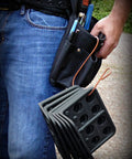 Box Of Fifty H2 Homer Helpers For Electrical Wire Management held in hand, with various tools in belt pocket.