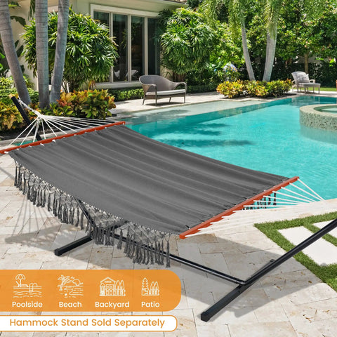 Cotton Double Hammock With 55 Inch Spreader Bar, Dark Gray, shown by a pool, Portable Camping Hammock Kit With Carrying Bag And Tree Straps