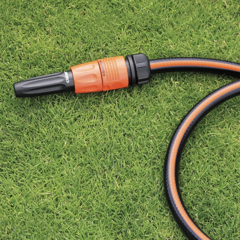 Heavy Duty Quick Connect Hose Fittings Half Inch Female Rubber Stop Coupling on green grass, designed for easy garden irrigation.