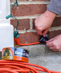 Heavy Duty Black Duct Tape Double Thick Adhesive For Indoor Outdoor Use Grips Rough Surfaces taped to brick wall