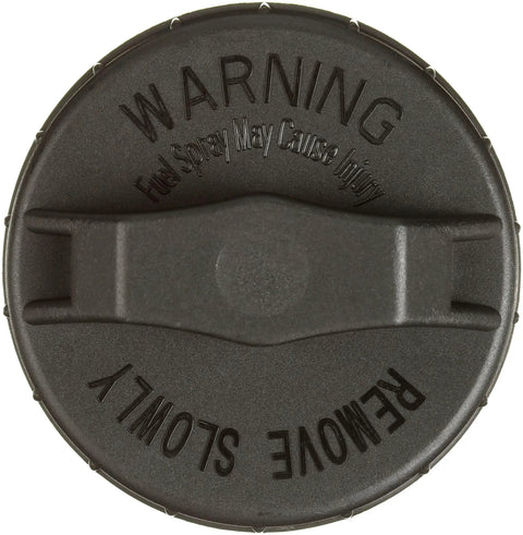 Top view of OE Equivalent Fuel Tank Cap 31748 For Vehicles Zinc Plated Fenderwell Style With Dichromate Dip featuring warning label.