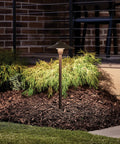 8 Inch Outdoor LED Path Light In Textured Architectural Bronze With 12V Adjustable Exterior Dome Light illuminating garden