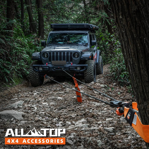 Heavy Duty 9/16 Inch 76 Foot Synthetic Winch Rope Kit With Hook Isolator Forged Hook Rubber Stopper And Safety Pull Strap 35000 Lbs Break Strength UHMWPE Recovery Cable For Off Road in use pulling SUV in forest terrain