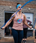 Person using Muay Thai 2.0 Weighted Jump Rope For High Intensity Training And MMA Workouts, Heavy 1.3lb PVC Rope, outside gym