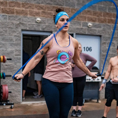 Person using Muay Thai 2.0 Weighted Jump Rope For High Intensity Training And MMA Workouts, Heavy 1.3lb PVC Rope, outside gym
